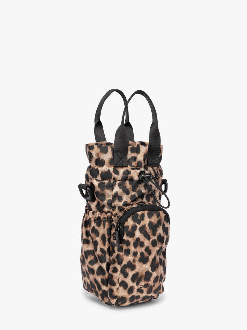 Tan and black animal print Leopard CALPAK Water Bottle Holder with top handles, drawstring top, front zippered pocket, and a detachable shoulder strap with an expandable top