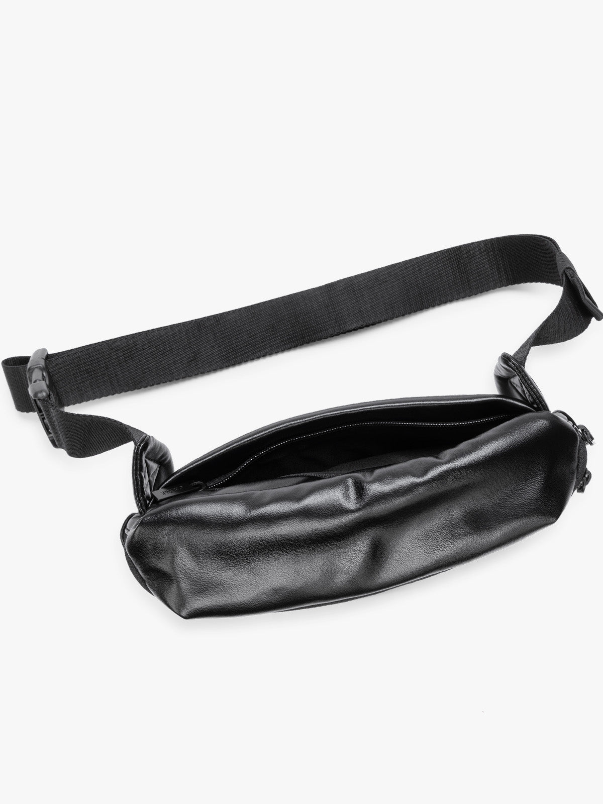 Top view of back zippered pocket of a black vegan leather CALPAK Luka Belt Bag with a zippered front pocket and side straps, shown against a plain white background; BB1901-BLACK-PU