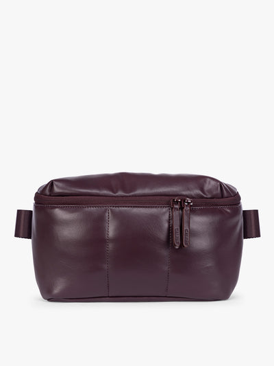 Deep burgundy Dark Cherry vegan leather CALPAK Luka Belt Bag with a zippered front pocket and side straps, shown against a plain white background; BB1901-DARK-CHERRY-PU view 1
