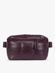 Deep burgundy Dark Cherry vegan leather CALPAK Luka Belt Bag with a zippered front pocket and side straps, shown against a plain white background; BB1901-DARK-CHERRY-PU