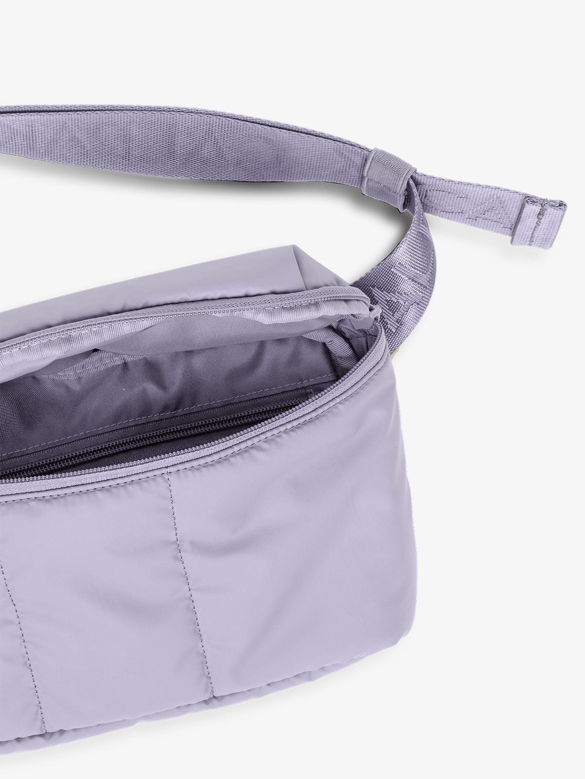 CALPAK Luka Belt Bag close up of interior in color purple lavender Orchid; BB1901-ORCHID