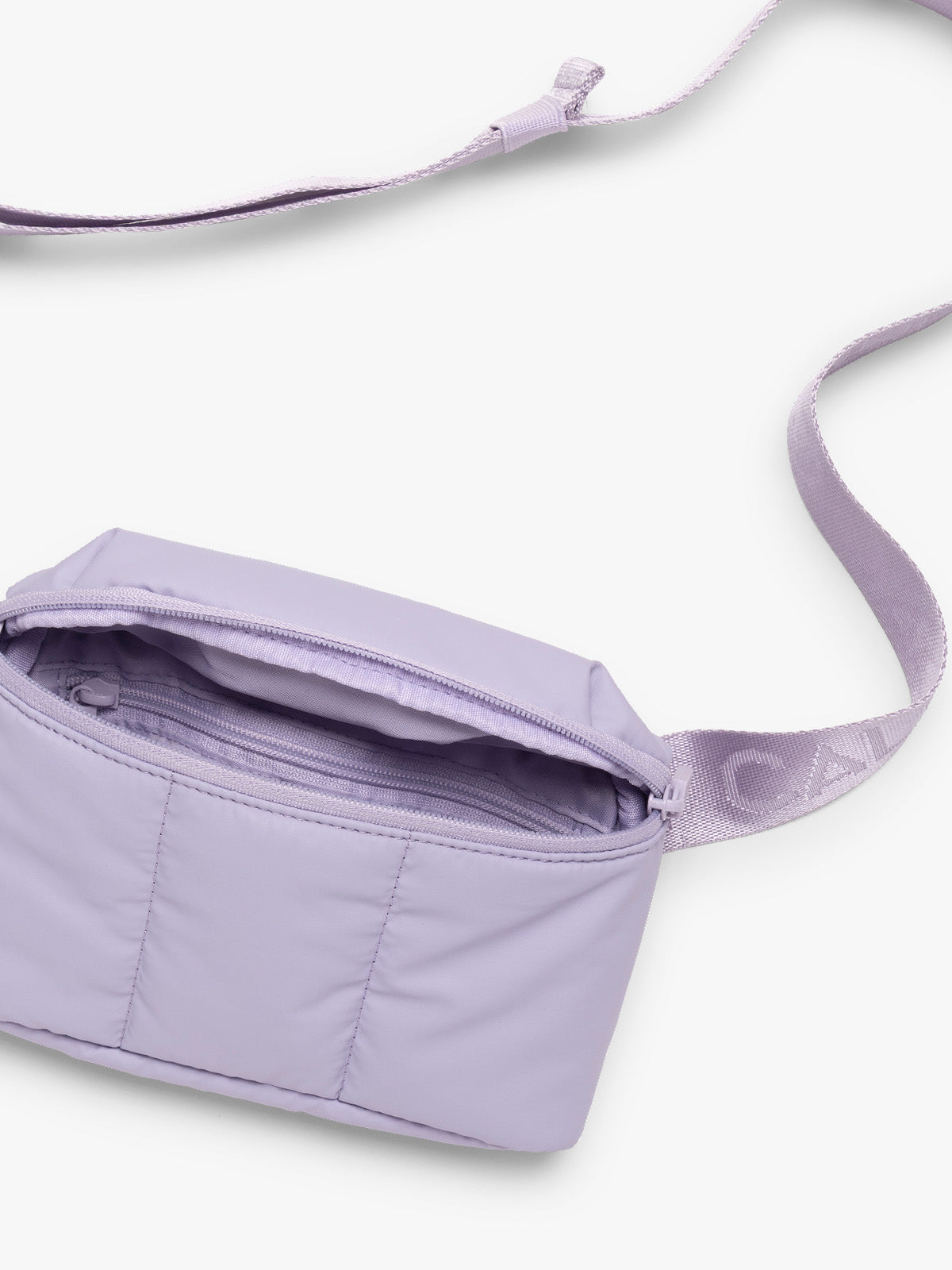 Opened with strap of CALPAK Luka Mini Belt Bag in light purple Orchid on white background; BBM2201-ORCHID