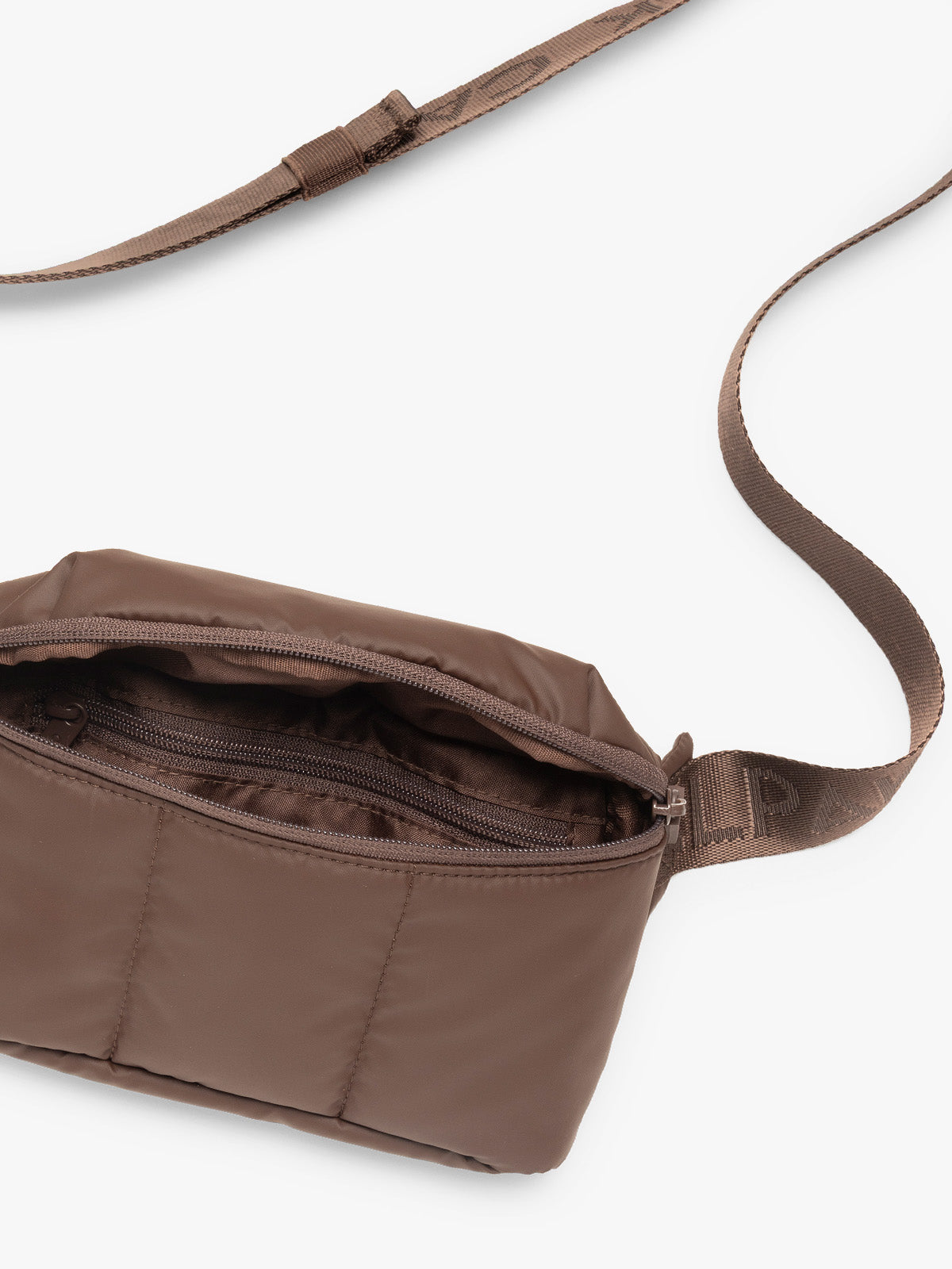 Opened and strap of CALPAK Luka Mini Belt Bag in brown Walnut on white background; BBM2201-WALNUT