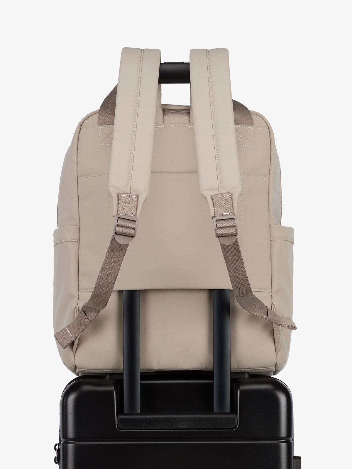 CALPAK Connect Laptop Backpack in grey beige Greige with luggage trolley sleeve on a white background; BCN2401-GREIGE