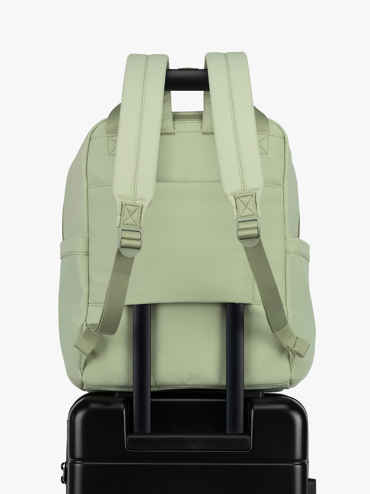 CALPAK Connect Laptop Backpack in light green Meadow with luggage trolley sleeve on a white background; BCN2401-MEADOW