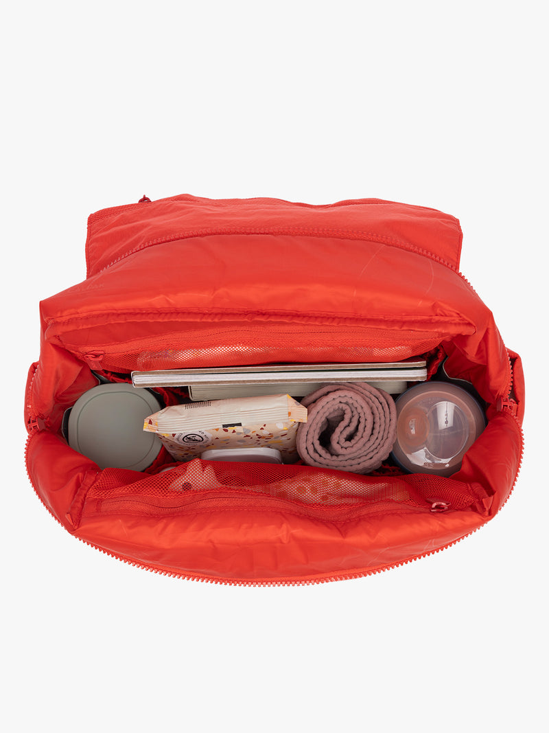 Baby items in CALPAK Diaper Backpack in red Tomato