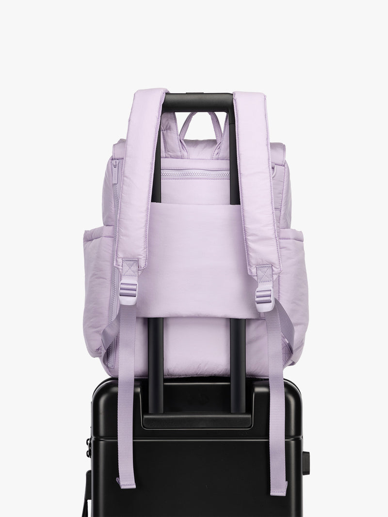CALPAK Diaper Backpack in lavender purple Orchid on luggage with trolley sleeve