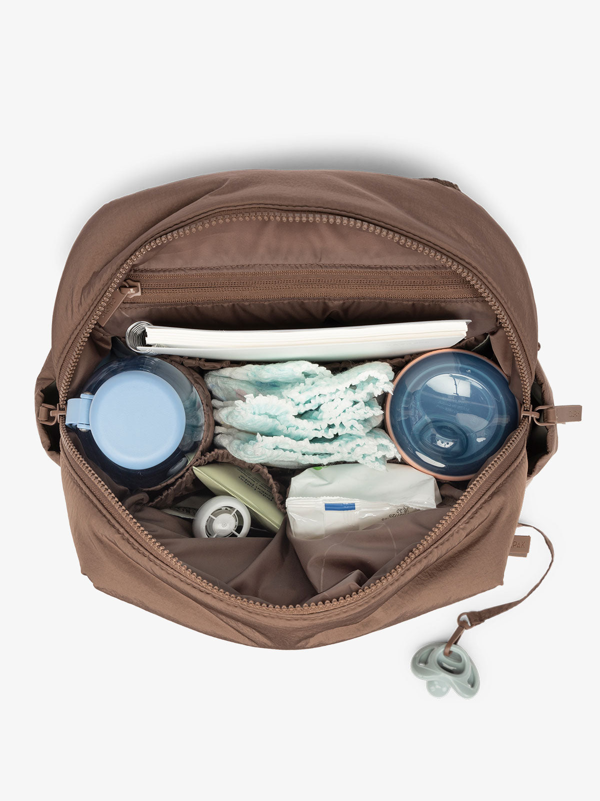 Inside view with baby items inside the CALPAK Mini Diaper Backpack in brown Hazelnut on a white background; BPC2402-HAZELNUT