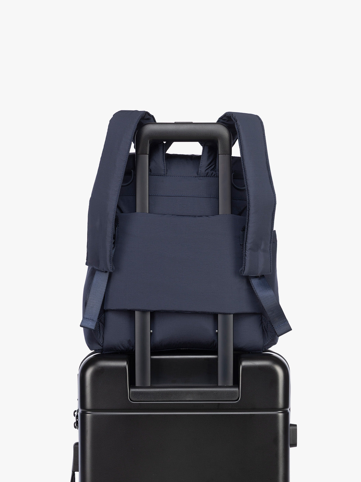 Luggage trolley sleeve of CALPAK Mini Diaper Backpack in blue Navy; BPC2402-NAVY