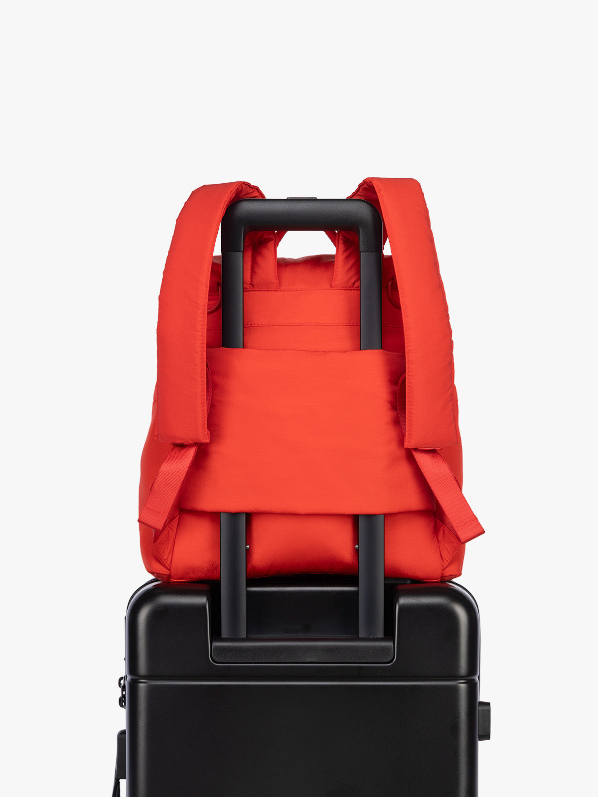 Luggage trolley sleeve of CALPAK Mini Diaper Backpack in red Tomato; BPC2402-TOMATO