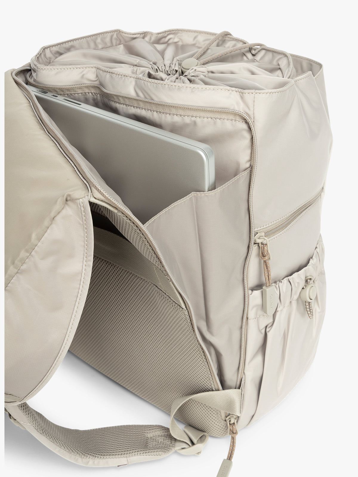 Laptop sleeve on the back of CALPAK Fit Gym Backpack in beige Greige with white background; BPF2601-GREIGE
