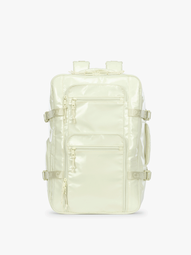 Gif of the front, back, and sides of the CALPAK Terra 26L Laptop Duffel Backpack with multiple pockets in light green Celadon on a white background