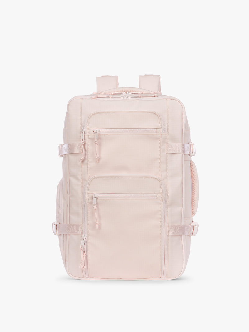CALPAK Terra 26L Laptop Duffel Backpack with multiple pockets in light pink Shell Pink on a white background