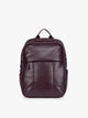 CALPAK Dark Cherry Luka 15 inch Laptop Backpack in vegan leather with a glossy finish, featuring a top carry handle, a main zippered compartment, and a front slip pocket, shown against a plain white background; BPL2001-DARK-CHERRY-PU