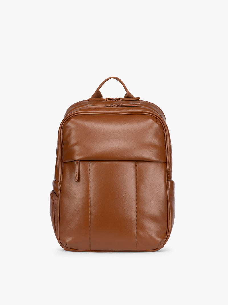 CALPAK Honey Brown Luka 15 inch Laptop Backpack in vegan leather with a glossy finish, featuring a top carry handle, a main zippered compartment, and a front slip pocket, shown against a plain white background