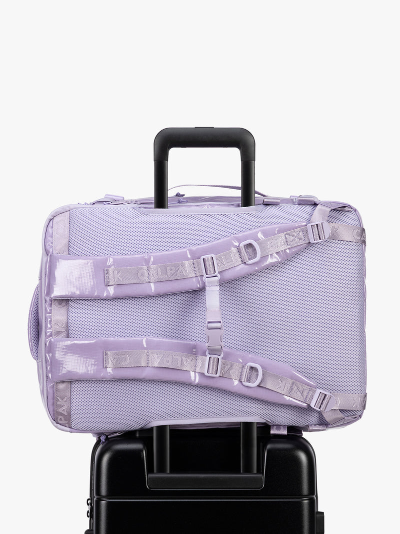 Back trolley sleeve of CALPAK Terra 35L Laptop Backpack Duffel in lavender Amethyst on a white background