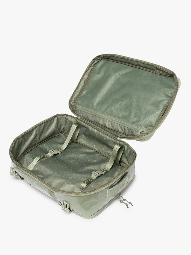Opened CALPAK Terra 35L Laptop Backpack Duffel in olive green Juniper on a white background
