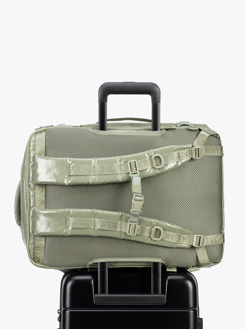 Back trolley sleeve of CALPAK Terra 35L Laptop Backpack Duffel in olive green Juniper on a white background