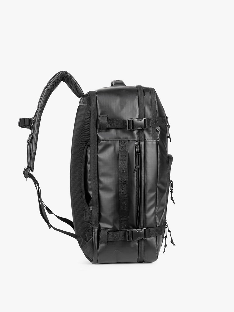 Side view of CALPAK Terra 35L Laptop Backpack Duffel in matte black Obsidian on a white background