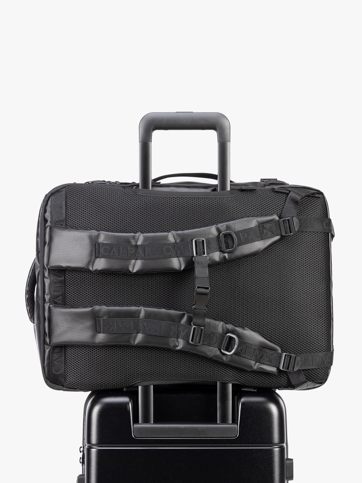 Back trolley sleeve of CALPAK Terra 35L Laptop Backpack Duffel in matte black Obsidian on a white background;  BPTL2601-MATTE-OBSIDIAN