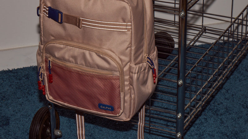CALPAK Kids Backpack in tan/brown Khaki with reflective webbing