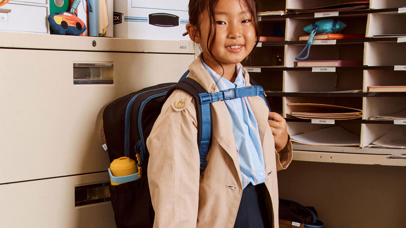 CALPAK Kids Backpack in Black with a Sternum Strap to secure backpack in place