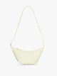 CALPAK Luka Crescent Tote bag in light green Celadon with shoulder strap and bag is expandable up to 2" on a white background; CBL2601-CELADON