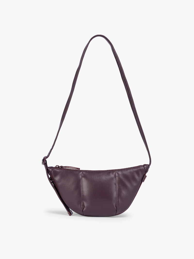 Dark Cherry deep burgundy vegan leather Luka Crescent shoulder bag with a long thin strap, shown against a plain light gray background