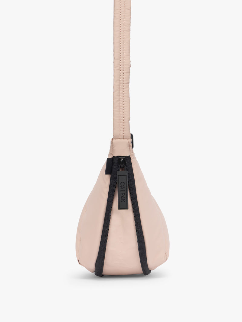 Side expandable zipper of CALPAK Luka Crescent Bag in light pink Rose Quartz