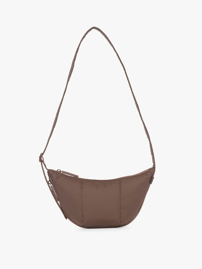 CALPAK Luka Crescent Tote bag in brown Walnut with shoulder strap and bag is expandable up to 2 on a white background; CBL2601-WALNUT view 1