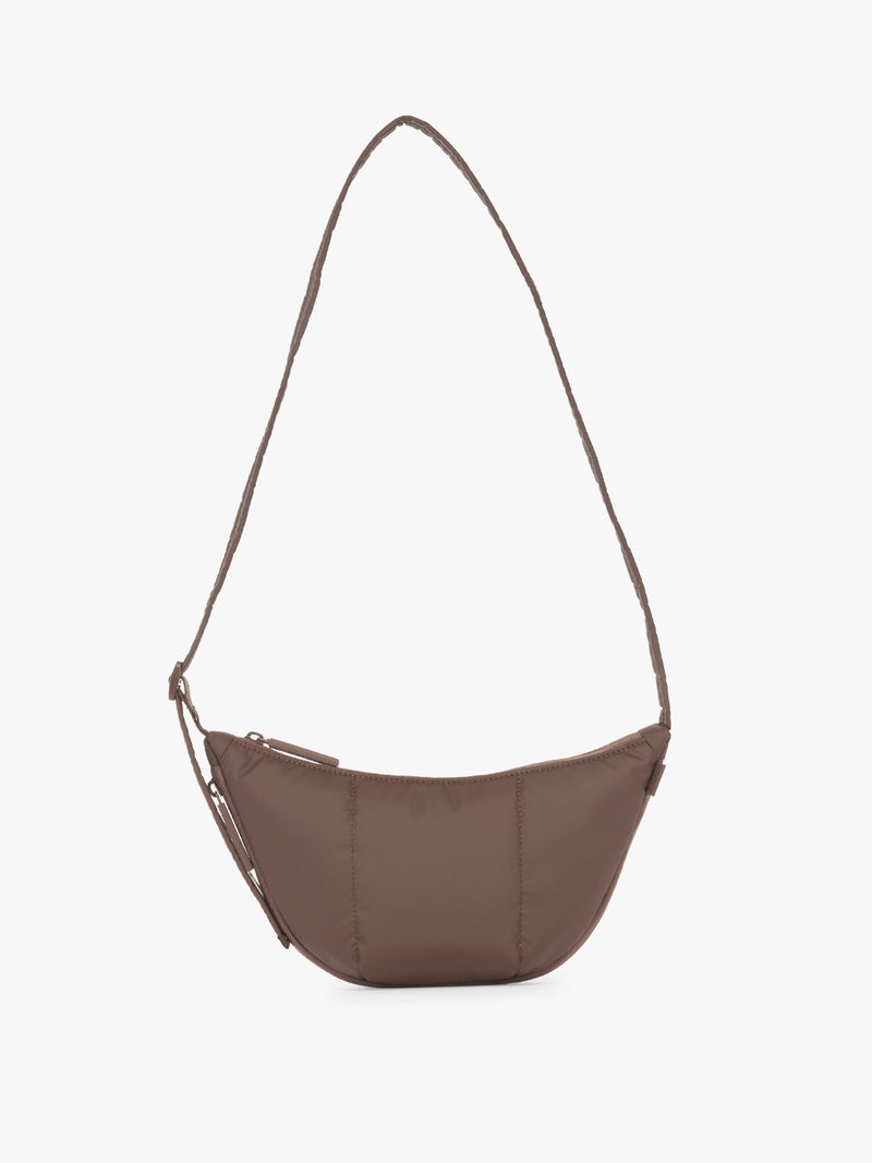 CALPAK Luka Crescent Tote bag in brown Walnut with shoulder strap and bag is expandable up to 2" on a white background