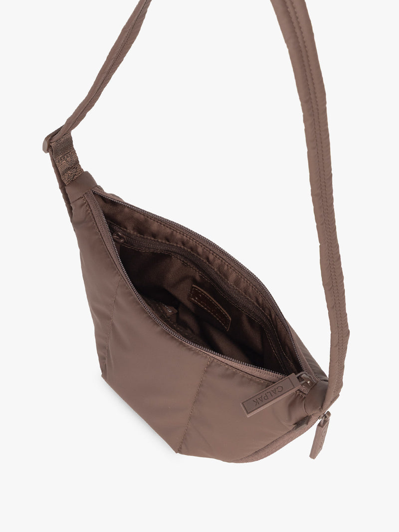 Opened interior of CALPAK Luka Crescent Tote bag in brown Walnut with shoulder strap and bag is expandable up to 2" on a white background