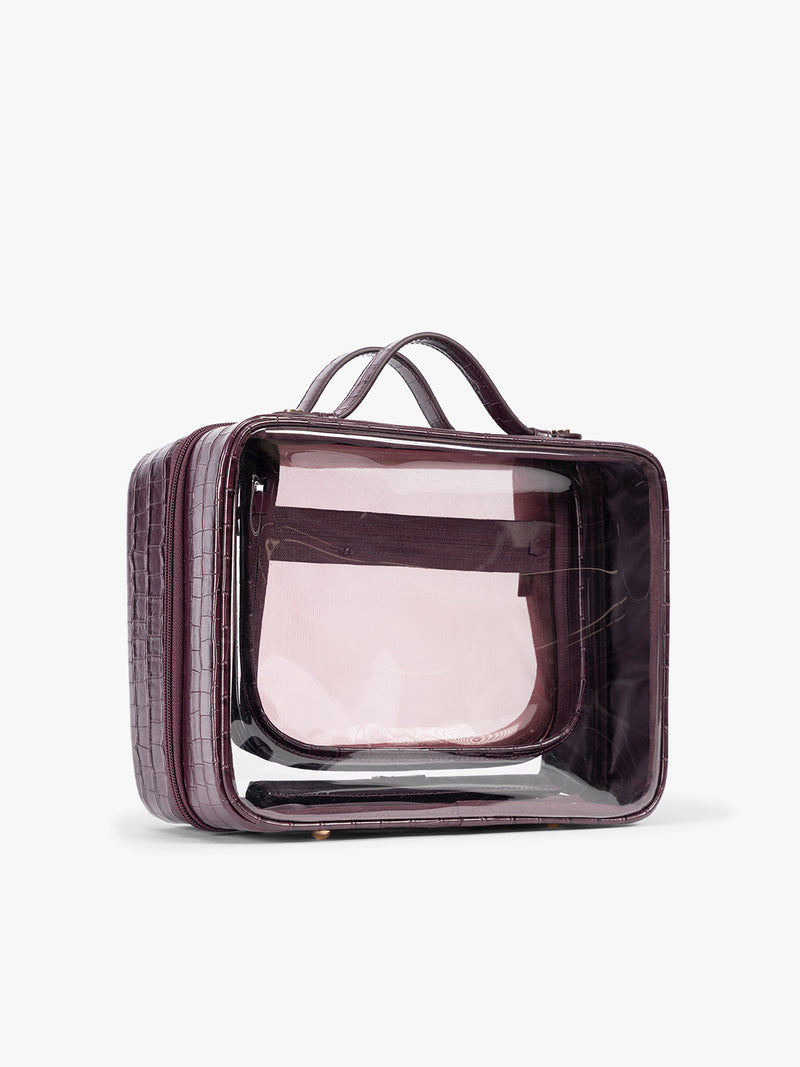 Side view of CALPAK Large Clear Cosmetics Case in deep red Dark Cherry against a white background