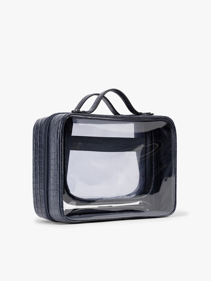Side view of CALPAK Large Clear Cosmetics Case in deep blue Navy croc-embossed against a white background