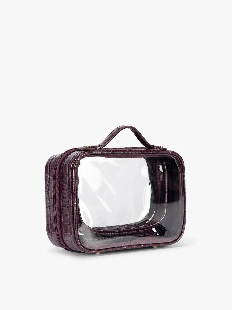 Side view of CALPAK Small Clear Cosmetics Case that is a transparent pouch with a deep red Dark Cherry in crocodile-embossed