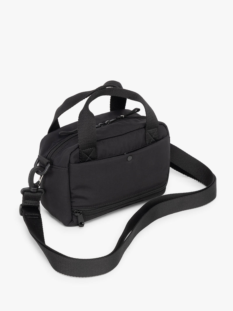 CALPAK Connect Crossbody Bag in Black with a strap on a white background
