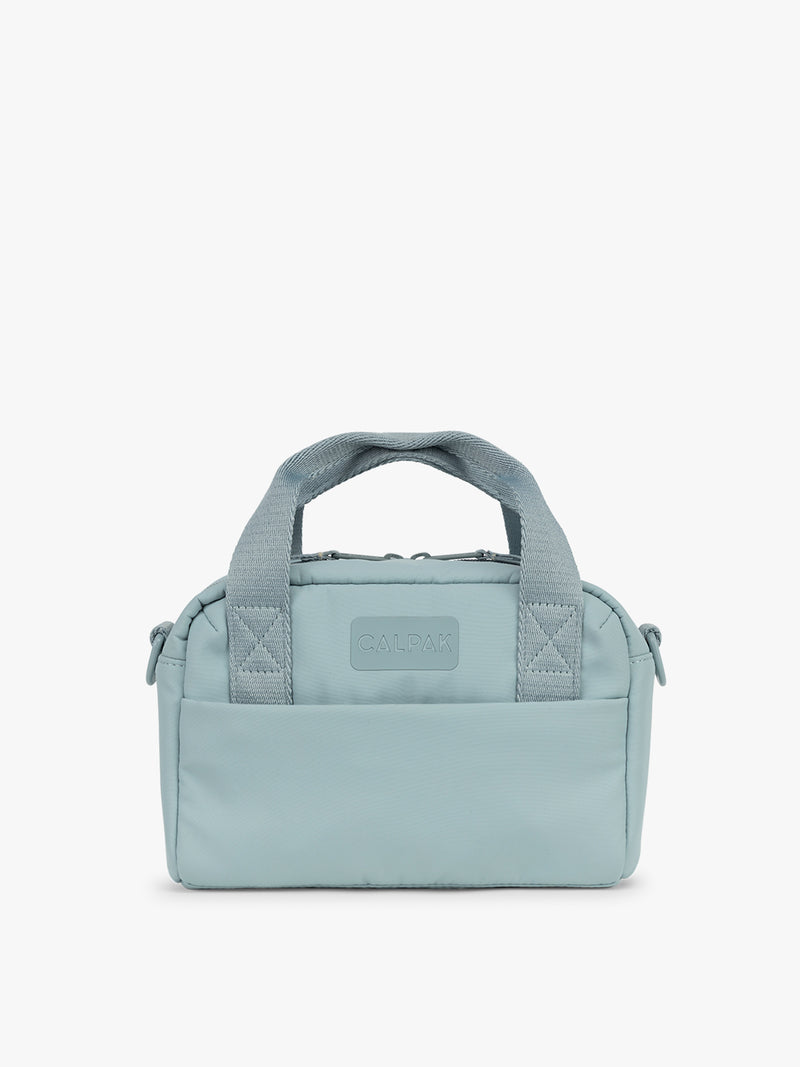 CALPAK Connect Crossbody Bag in light blue Bluebell with a visible brand logo on a white background