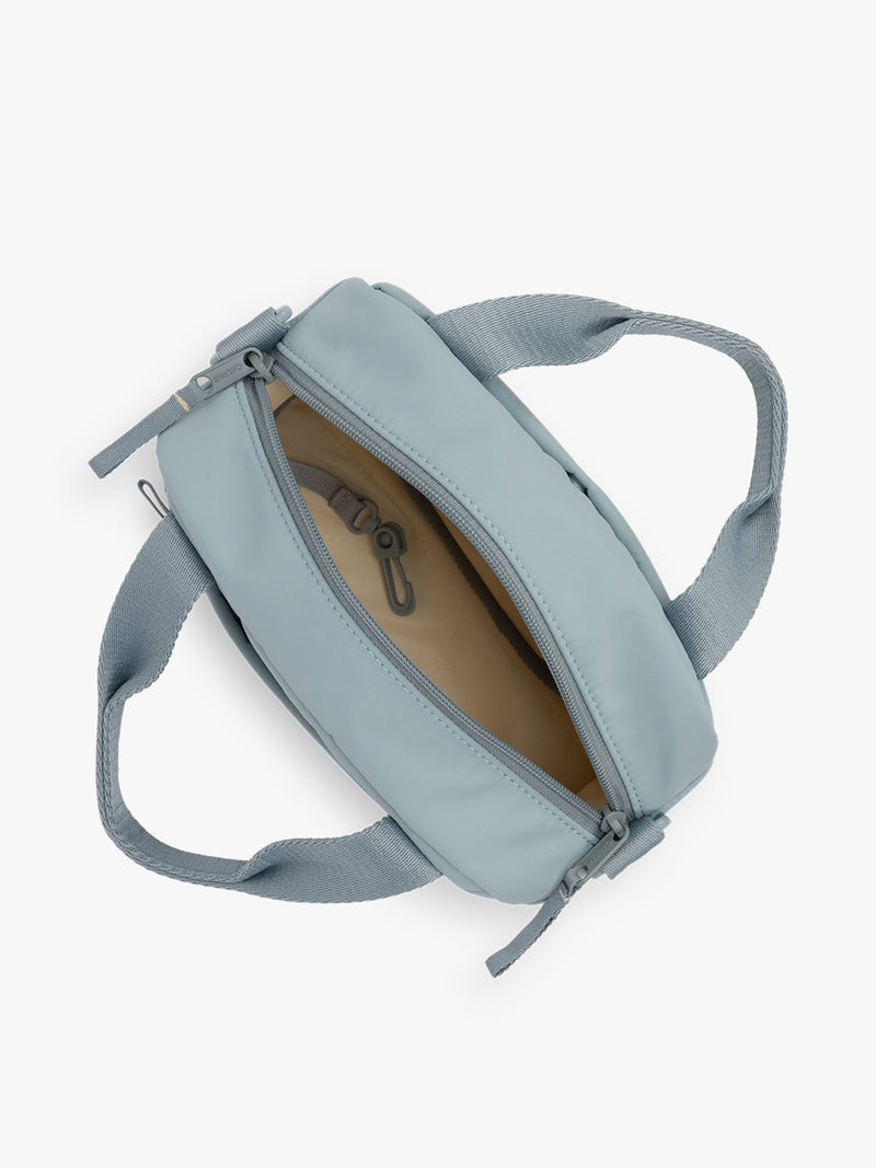 CALPAK Connect Crossbody Bag with adjustable strap in light blue color Bluebell