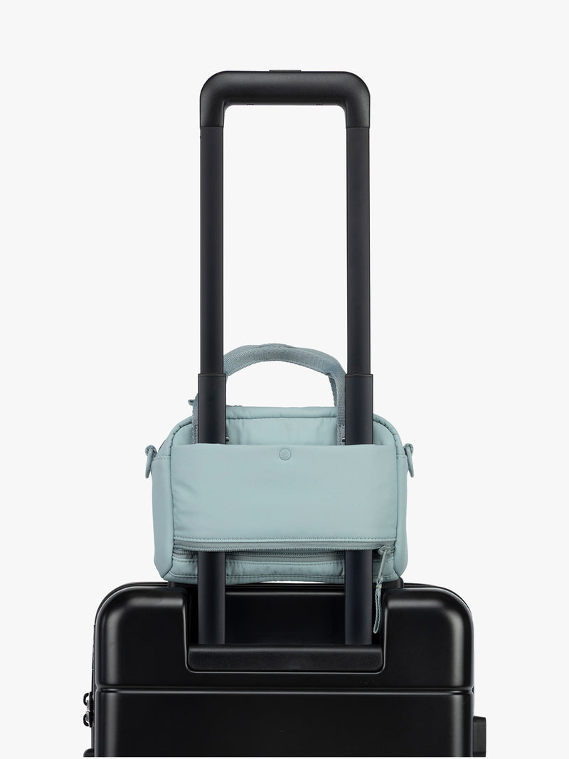 CALPAK Connect Crossbody Bag with trolley sleeve in light blue Bluebell