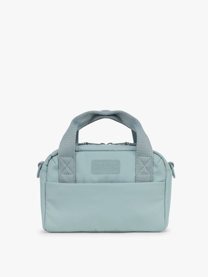 CALPAK Connect Crossbody Bag in light blue Bluebell with a visible brand logo on a white background