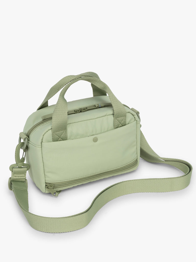 CALPAK Connect Crossbody Bag in beige light green Meadow with a shoulder strap on a white background