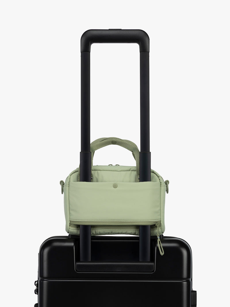 CALPAK Connect Crossbody Bag with trolley sleeve in light green Meadow