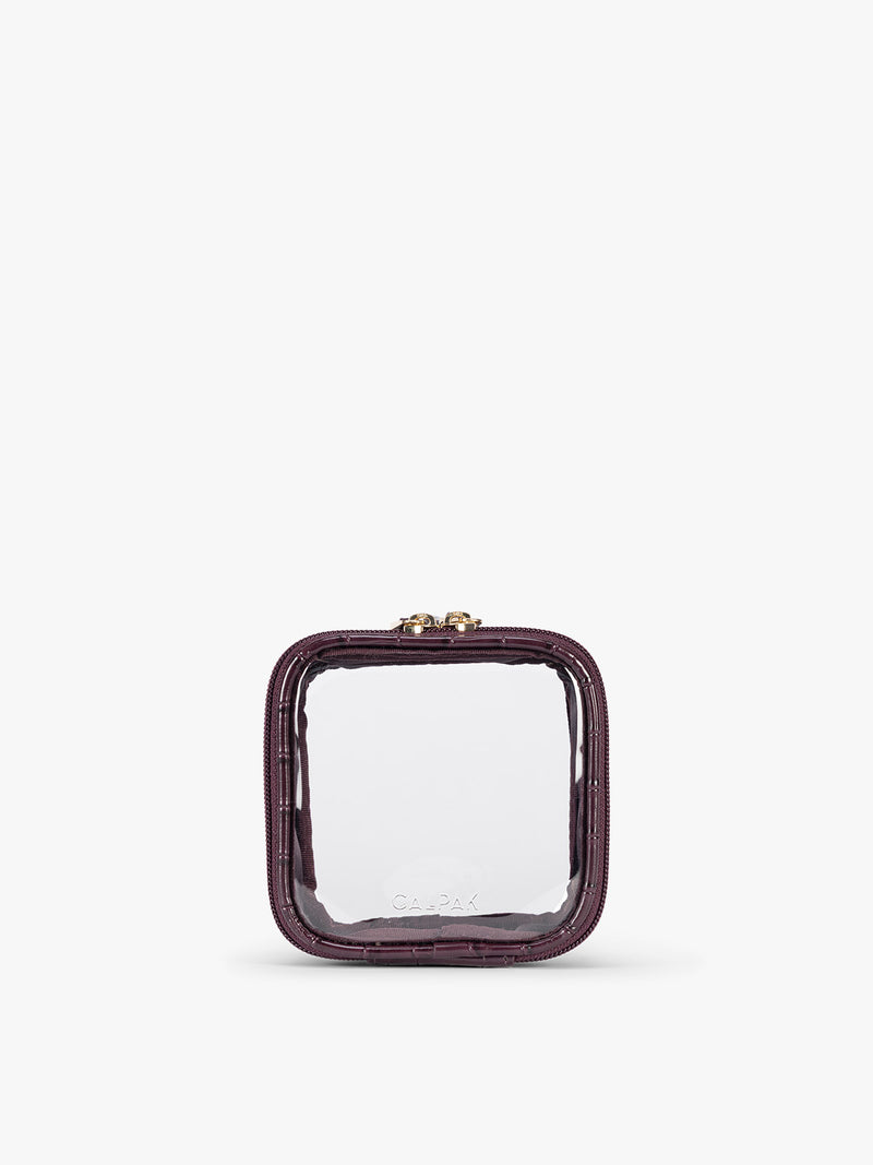 CALPAK Tiny Clear Cosmetics Case that is a transparent pouch with a deep red Dark Cherry in crocodile-embossed