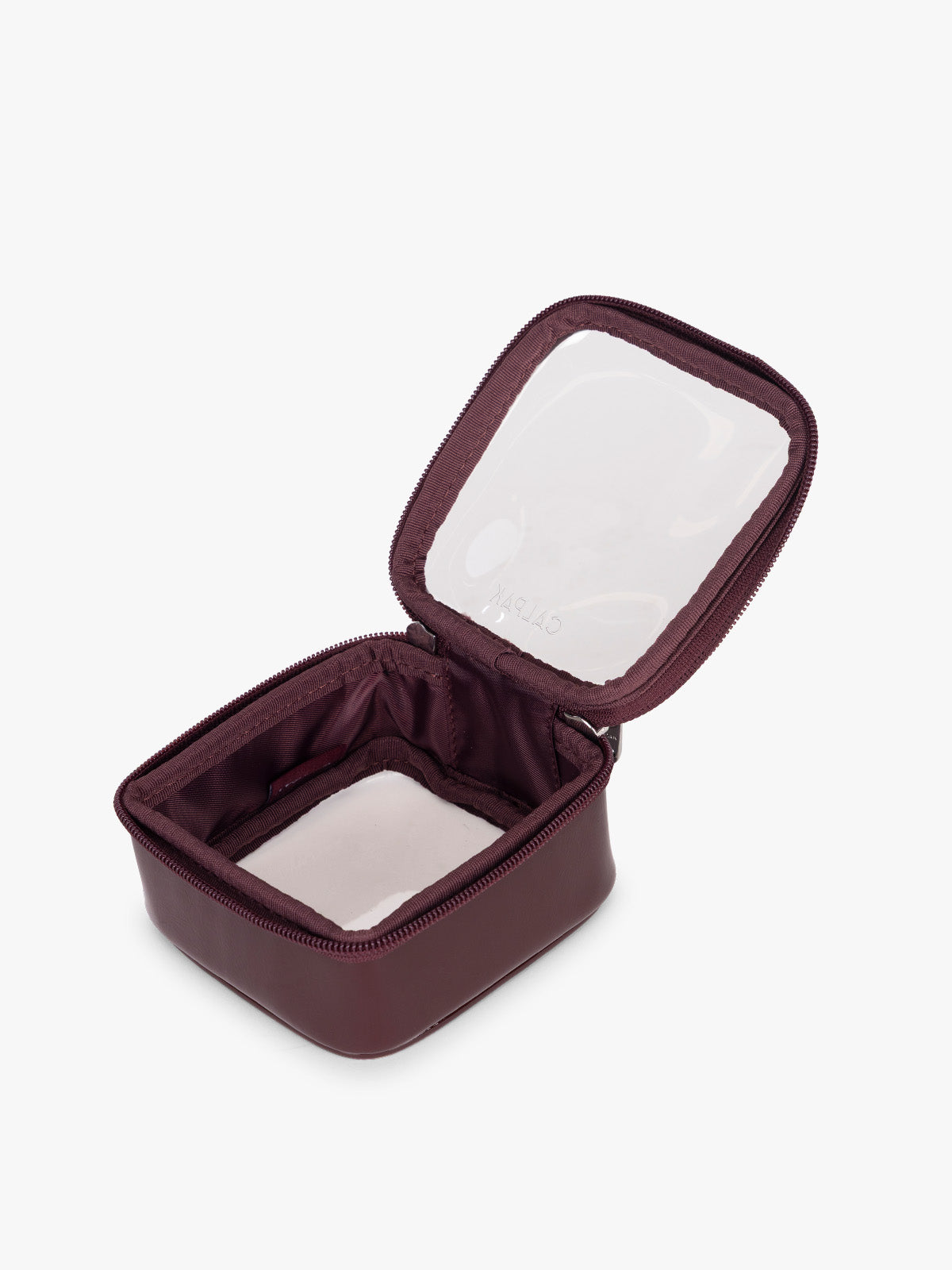 Opened view of CALPAK Tiny Clear Cosmetics Case in maroon Dark Cherry; CCT2501-GLAZED-DARK-CHERRY