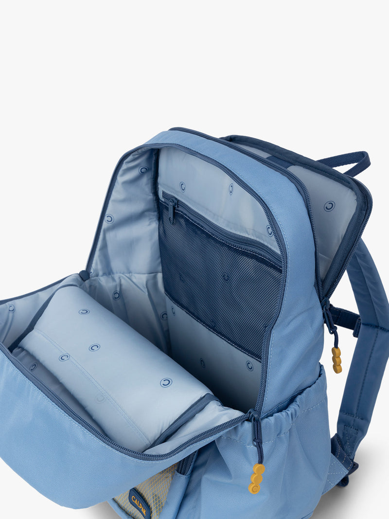 CALPAK Kids Large Backpack in Blue for ages 8-12 with back luggage trolley sleeve