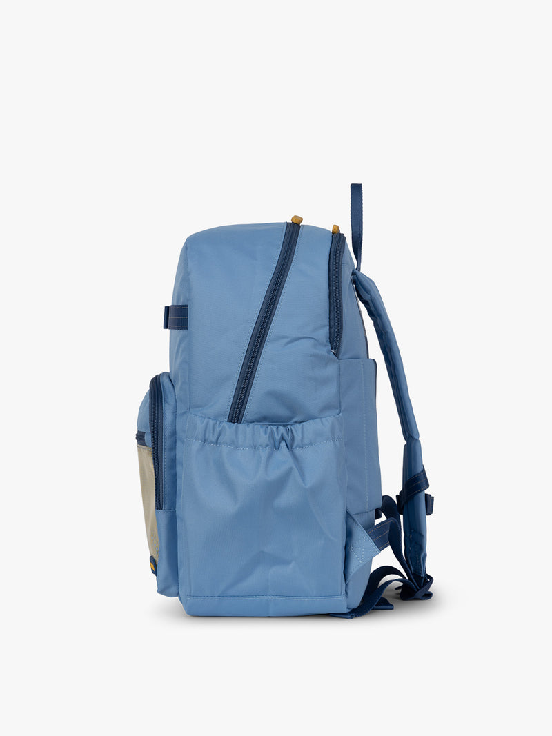 CALPAK Kids Large Backpack in Blue for ages 8-12 side view with water bottle holder pocket