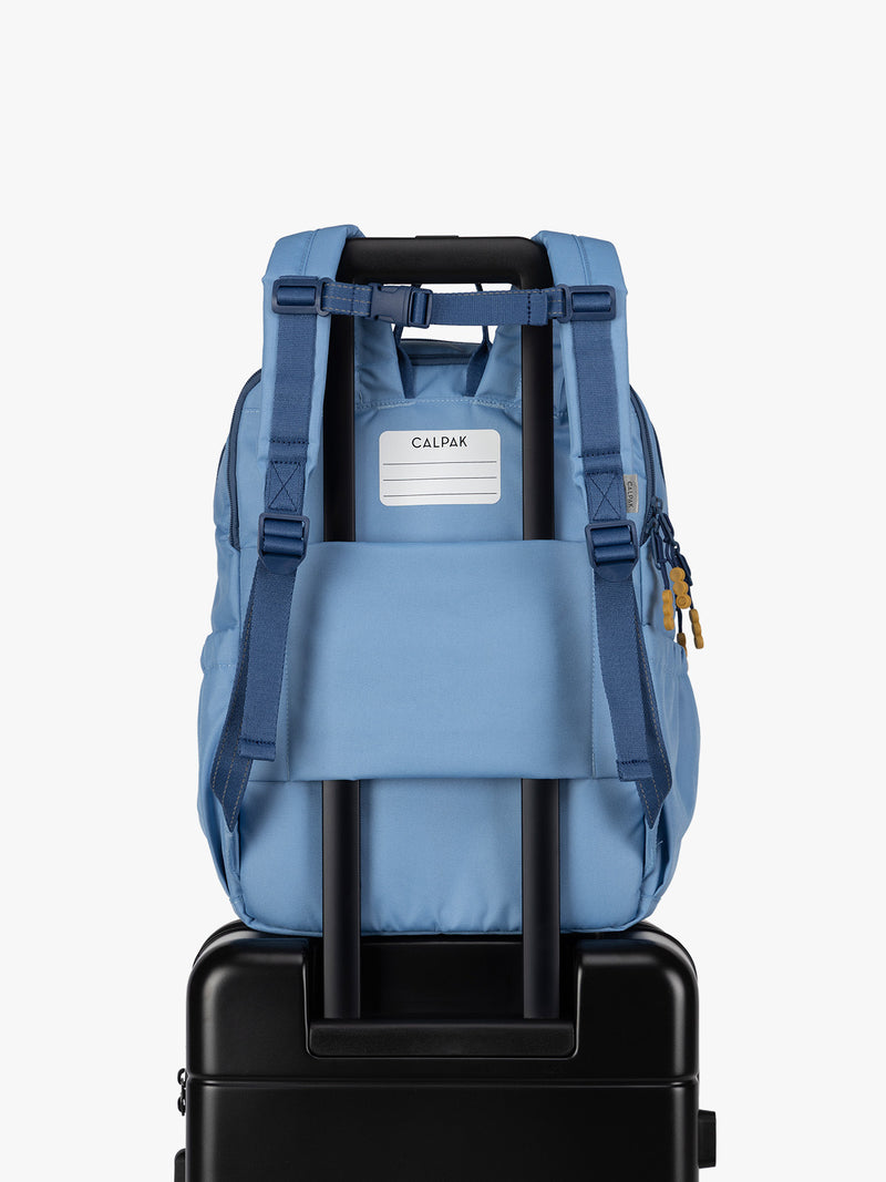 CALPAK Kids Large Backpack in Blue for ages 8-12 opened view with multiple interior pockets and blue lining