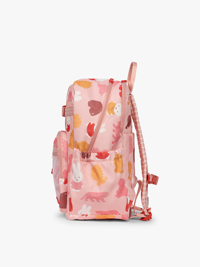 Side view of CALPAK Kids Large Backpack with Miffy and pink colorful animal pattern on a white background