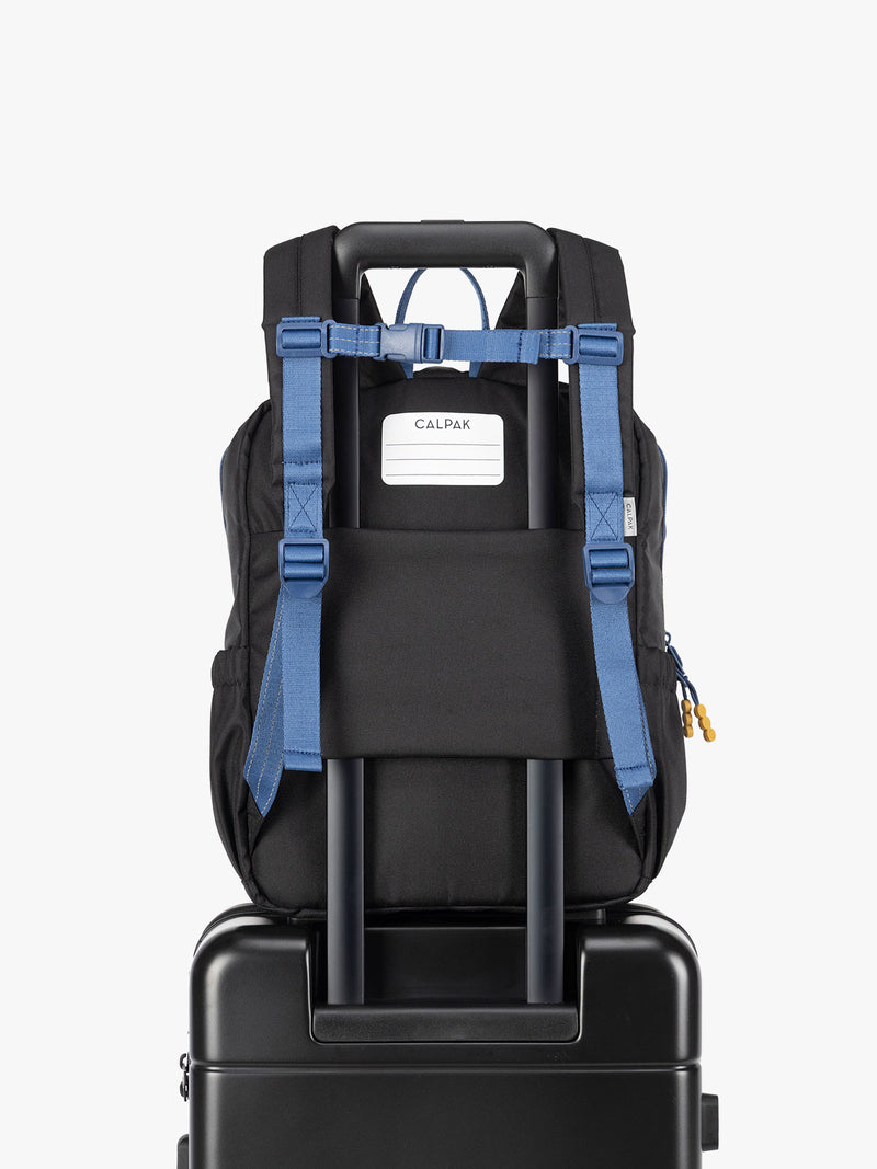 CALPAK Kids Medium Backpack in Black for ages 5-8 with back luggage trolley sleeve
