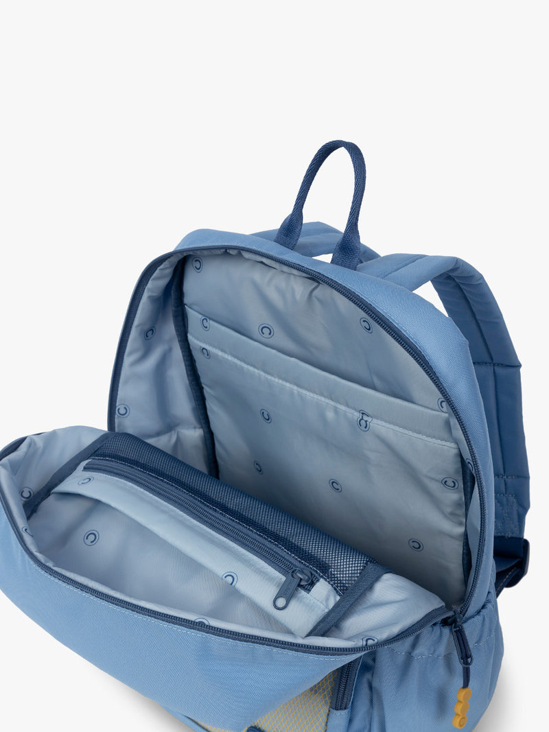CALPAK Kids Medium Backpack in Blue for ages 5-8 opened view with multiple interior pockets and blue lining